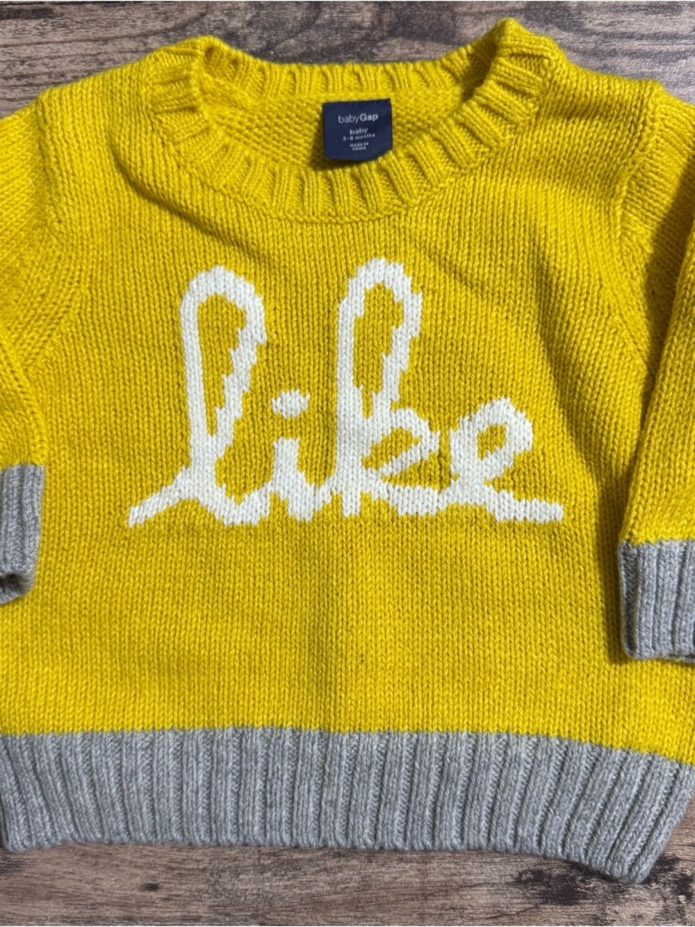 GAP baby 3-6 months yellow knit sweater with white lettering “Like” NWT